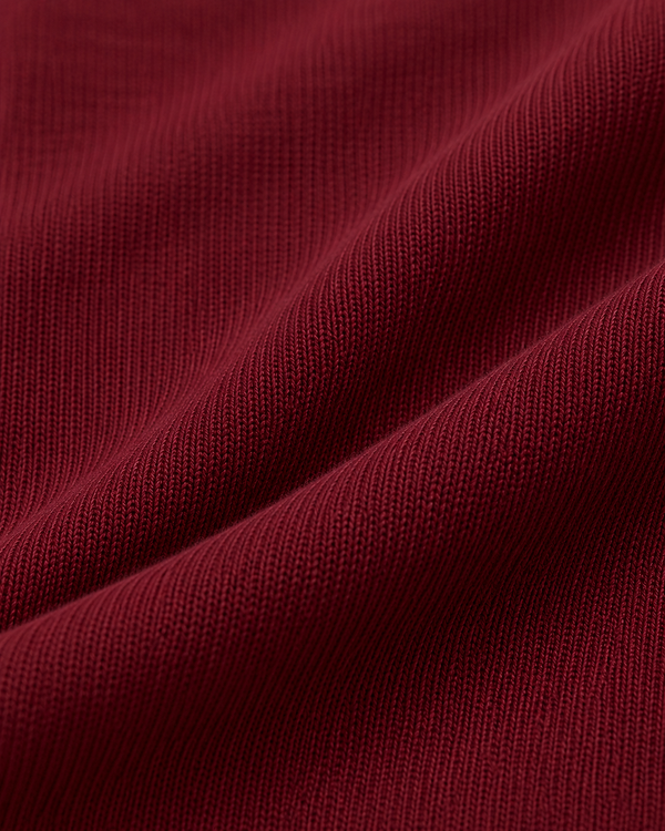 Polo de manga larga con cuello con cremallera, color granate